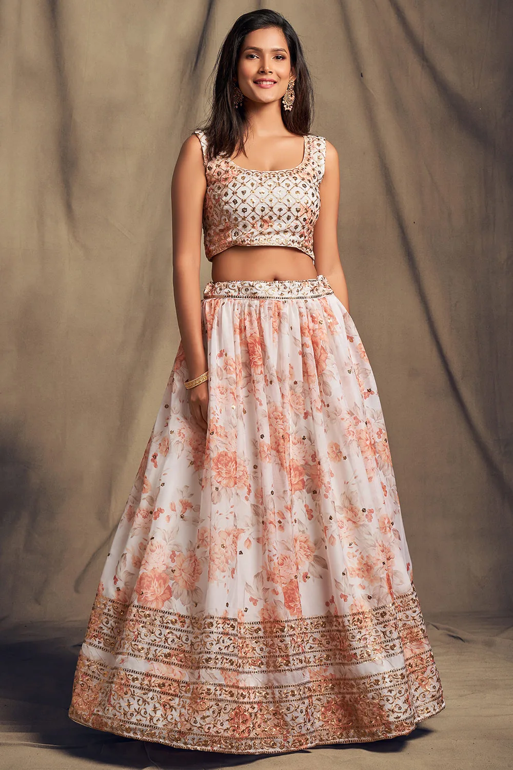 Enchanting Off-White Floral Organza Lehenga Choli Set with Sequins Zari Embroidery Work Enchanting Off-White Floral Organza Lehenga Choli Set with Sequins Zari Embroidery Work