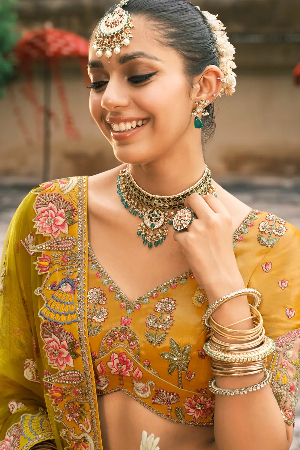 Close-up of mirror work on yellow haldi lehenga