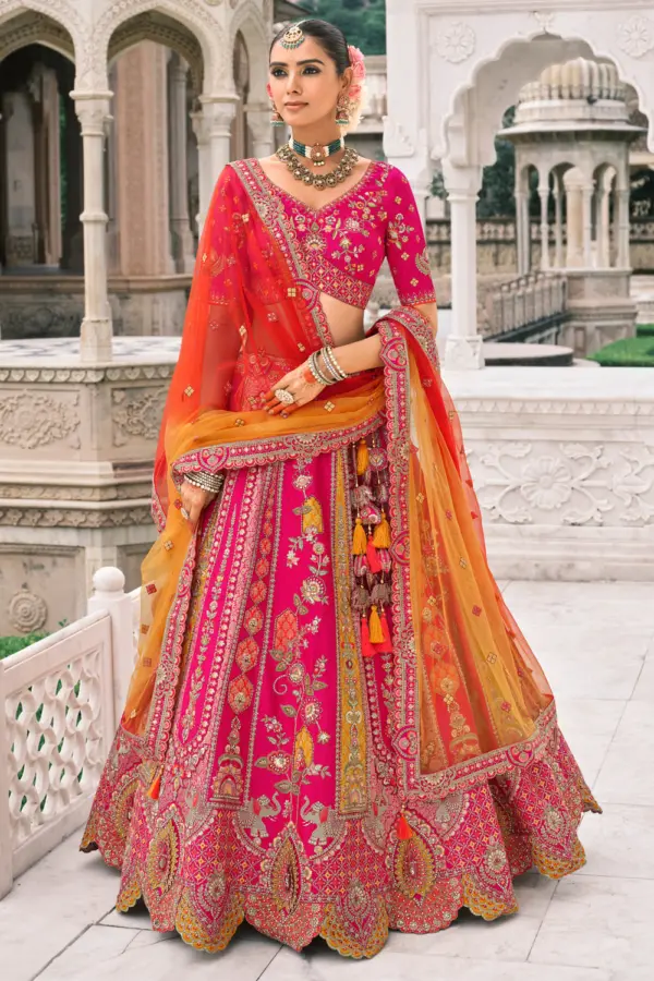Pink bridal lehenga front view showcasing elaborate embroidery