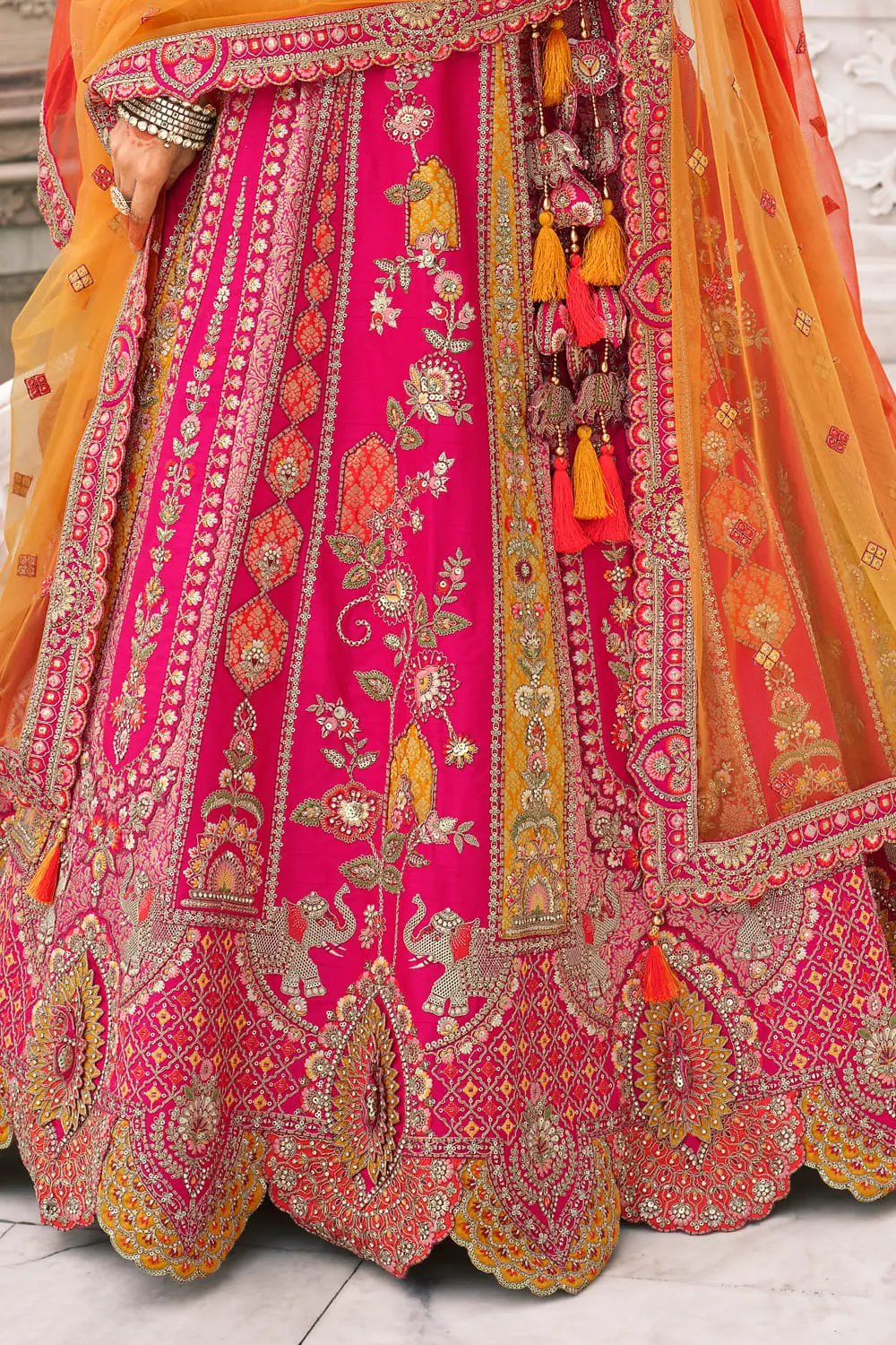 Back detail of bridal lehenga with intricate cut work border