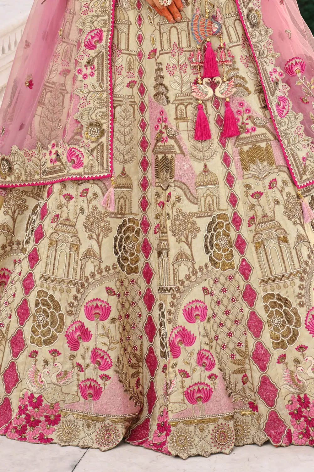 Ivory and pink bridal lehenga modeled for wedding inspiration