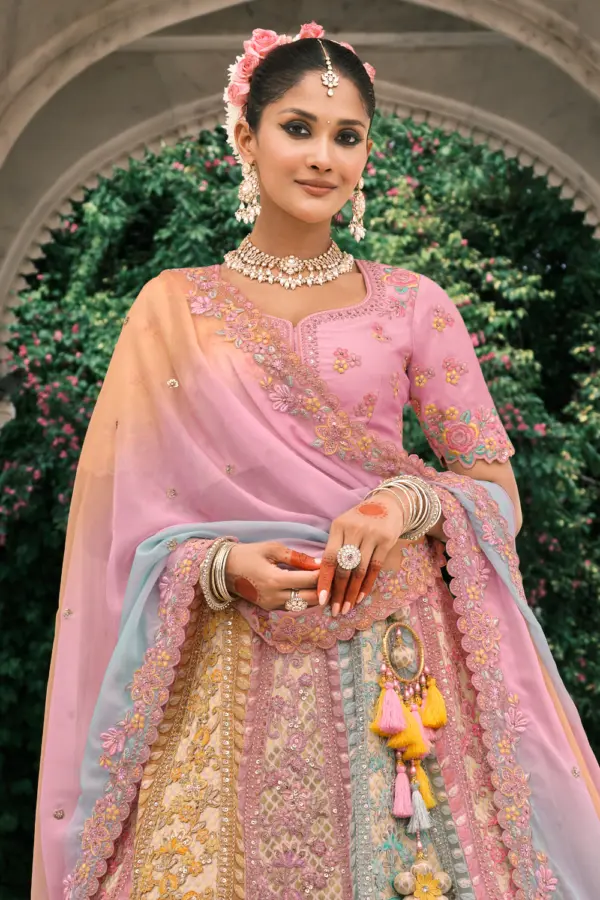 Close-up of stone and mirror work on dusty rose lehenga