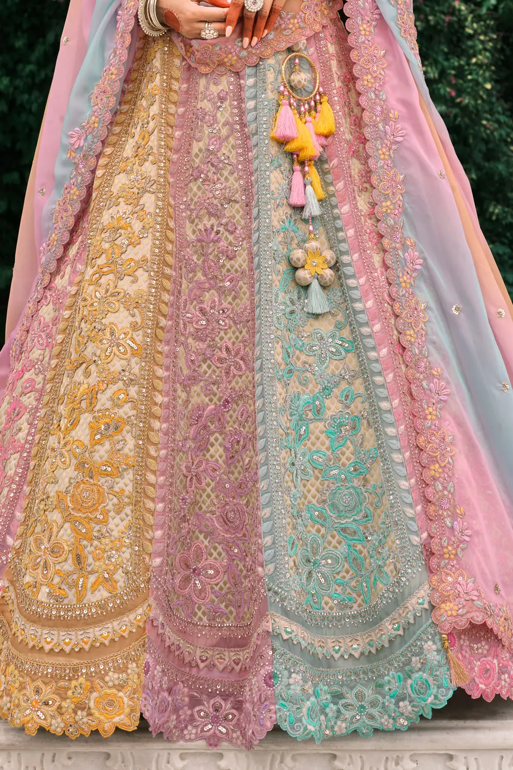 Back detail of dusty pink lehenga showcasing intricate patterns