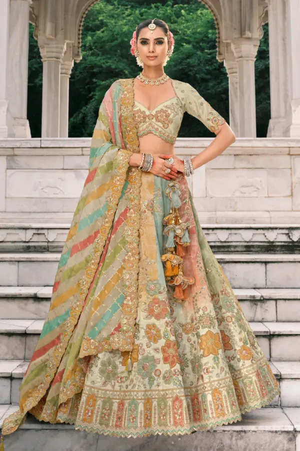 Cream lehenga front view showcasing gold embroidery detail