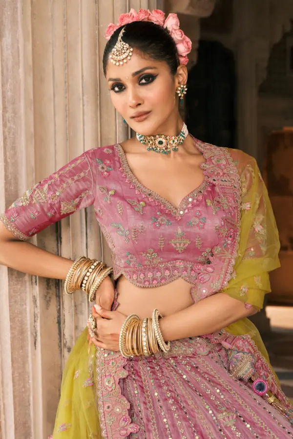 Close-up detail of the fancy silk fabric, cut-work border, and stone work on this designer lehenga.