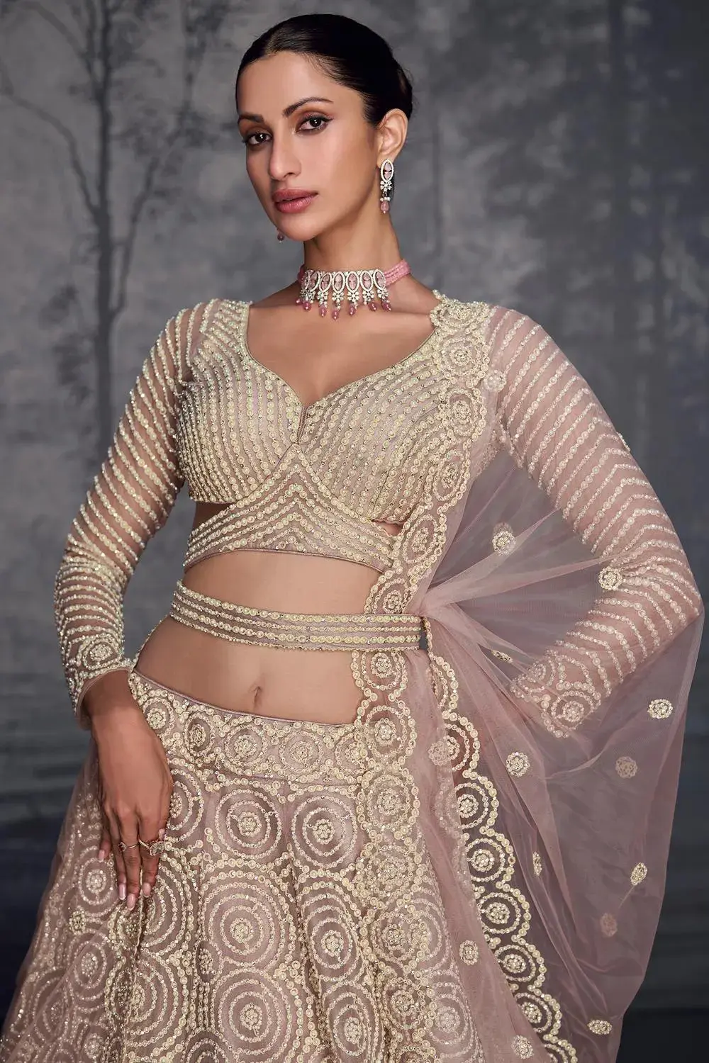 Closeup shot of net lehenga blouse design featuring intricate diamond embroidery.
