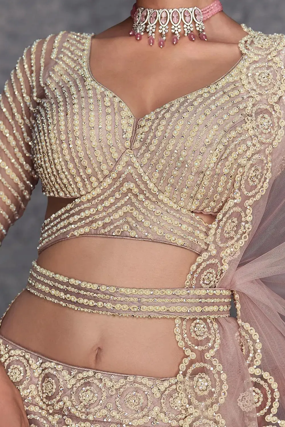 Side view of the beige lehenga for women showing the volume and silhouette.