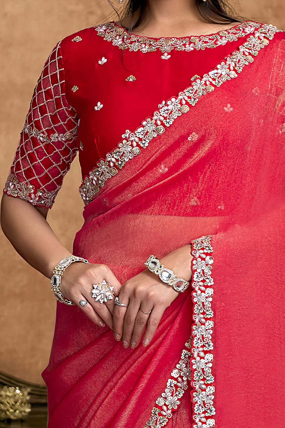 Model wearing cherry red festive saree