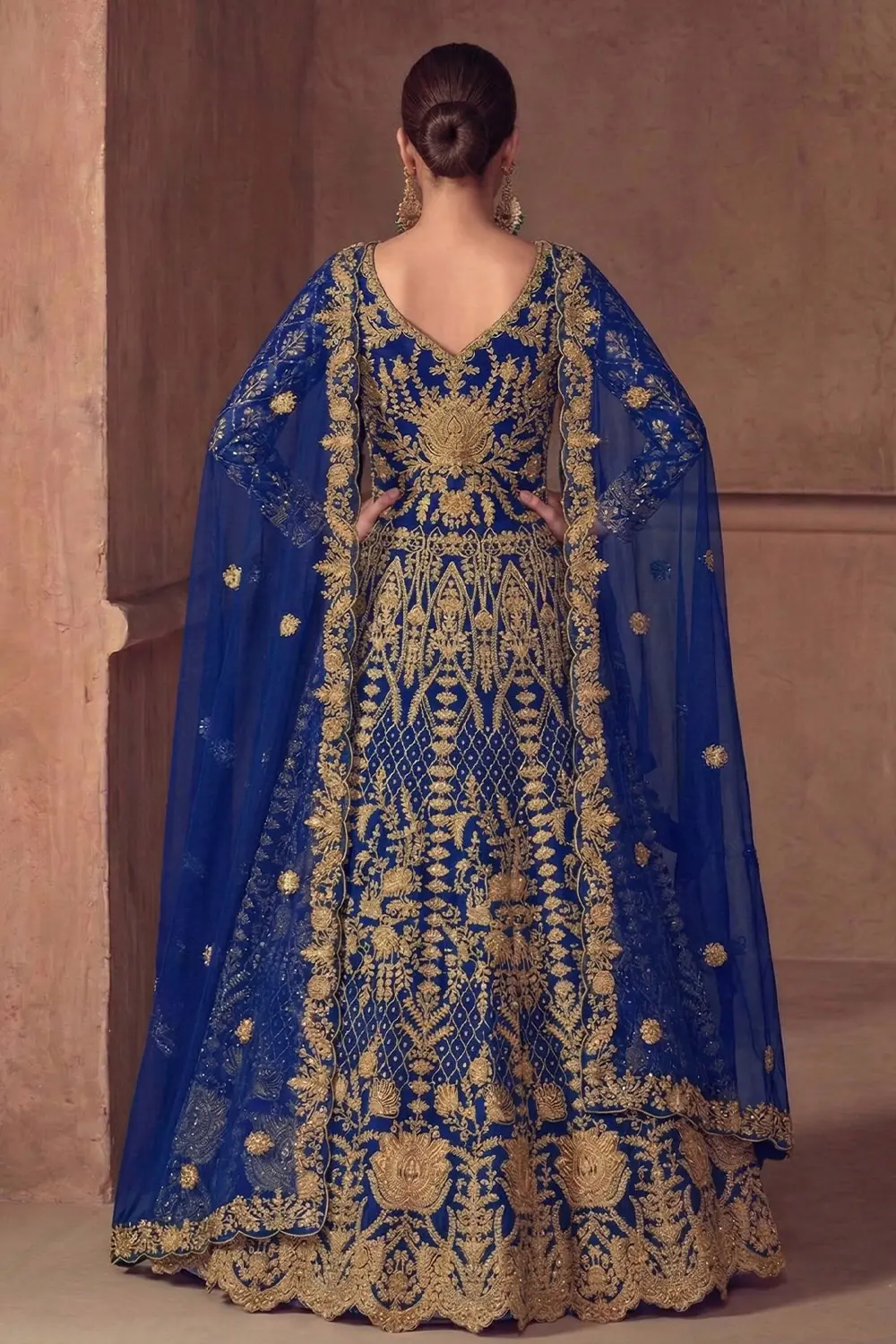 Model wearing the Embroidered Anarkali Gown with traditional jhumkas and minimalist styling.