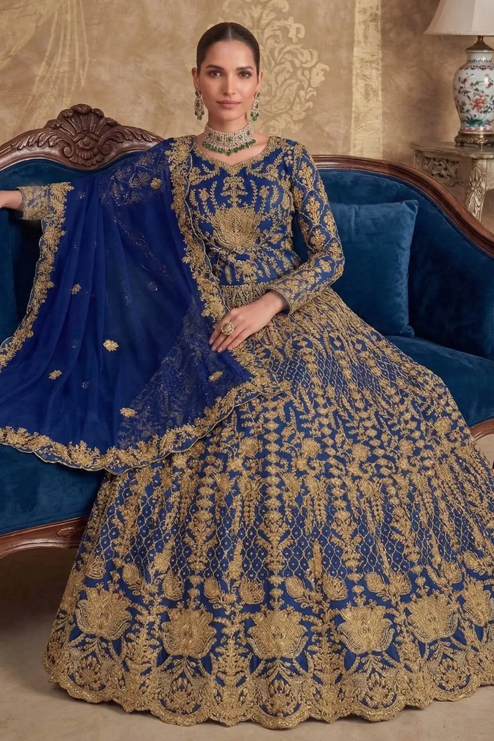 Side profile of the Elegant Silk Anarkali gown with flowing net dupatta and fitted silhouette.