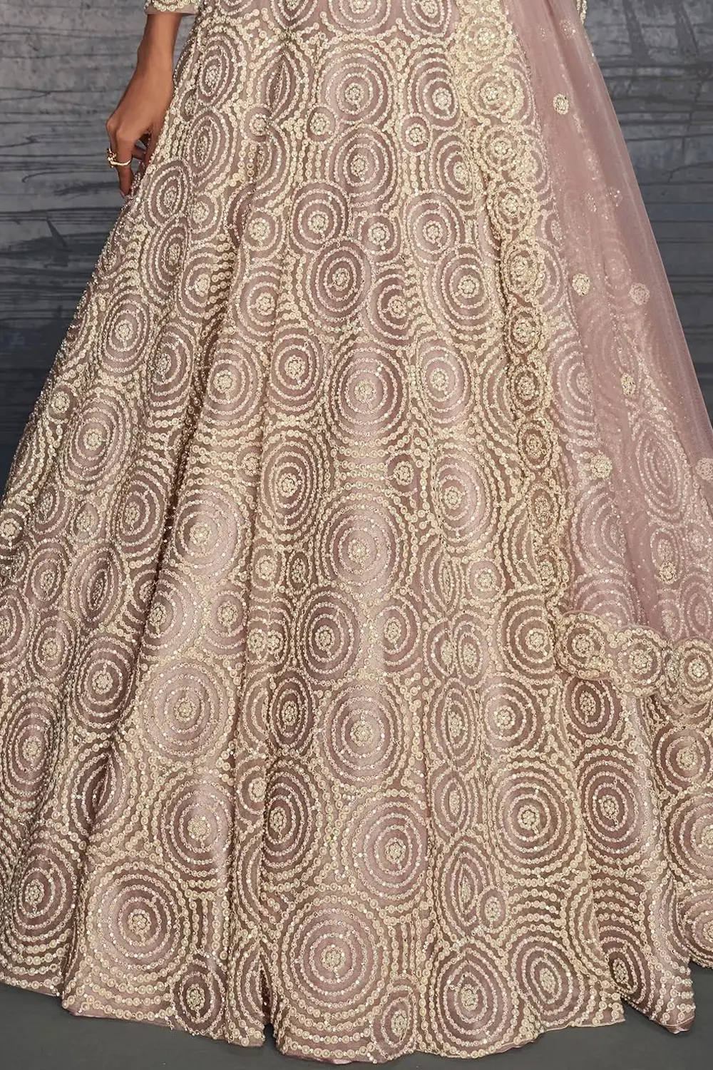 Flared can-can lehenga skirt with hand embroidery and Moti work.