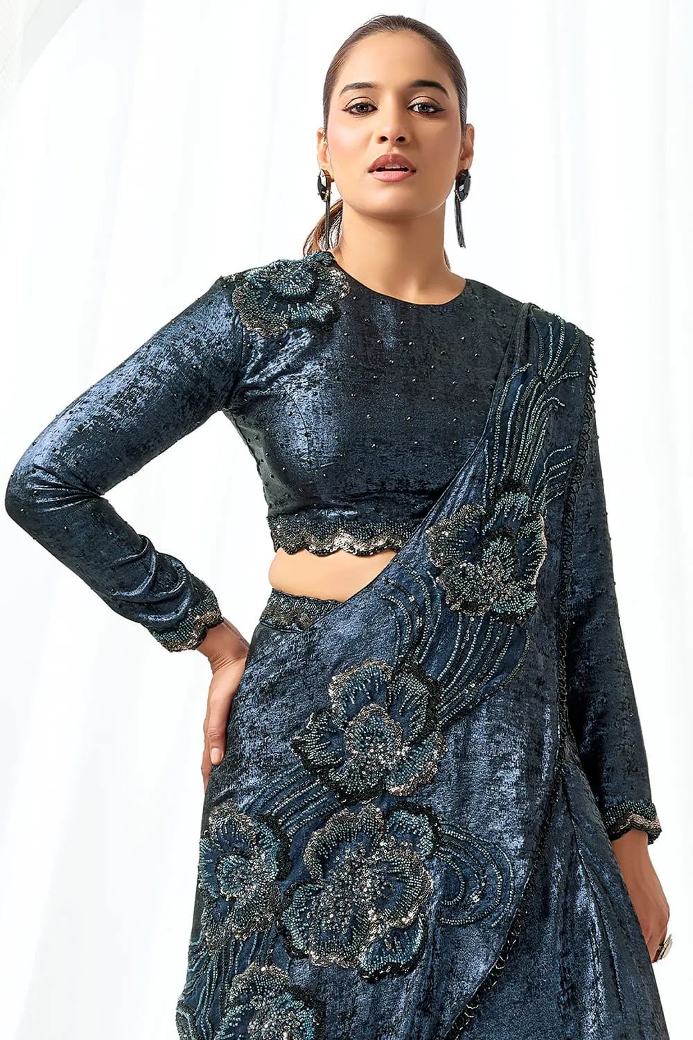 Close up of beads and cutdana work on blue saree gown dress