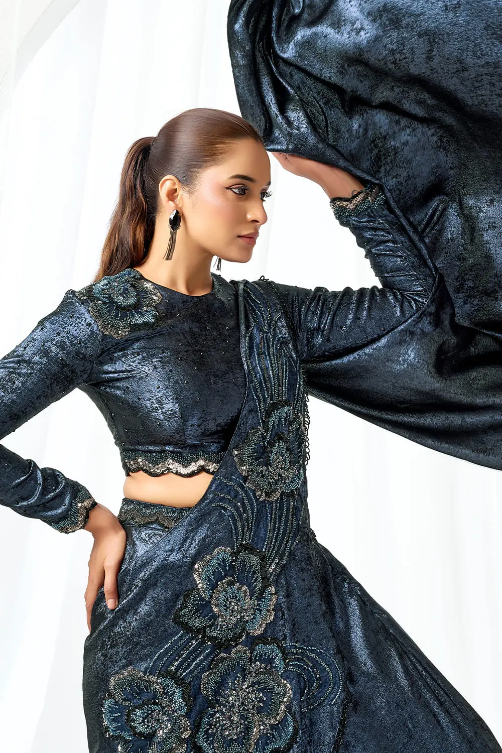 Side drape of saree gown with embellishments on metallic satin