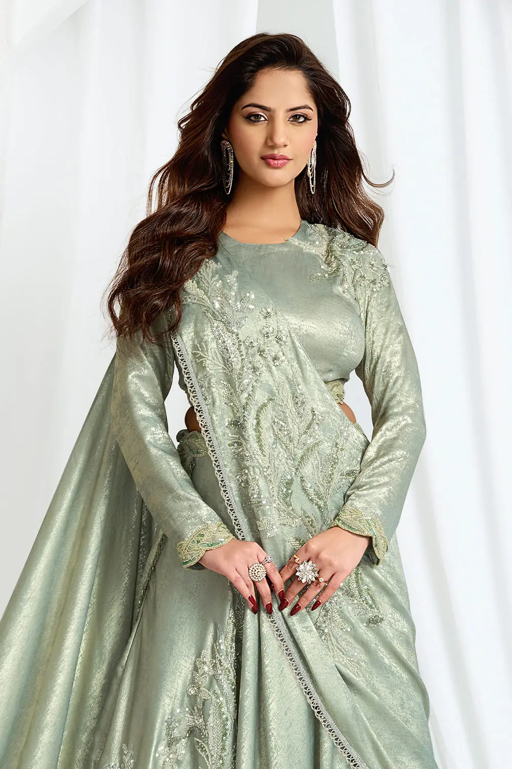 Close up of beads and cutdana on leaf motifs of saree style gown
