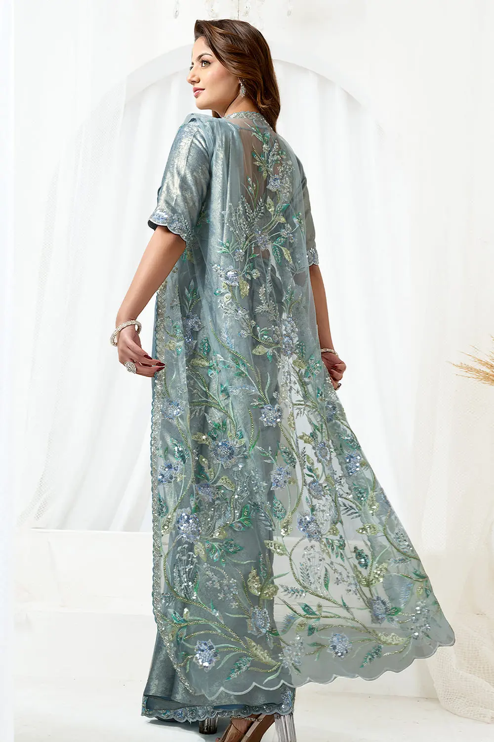 Pre draped saree back view with open jacket revealing Maharani net blouse
