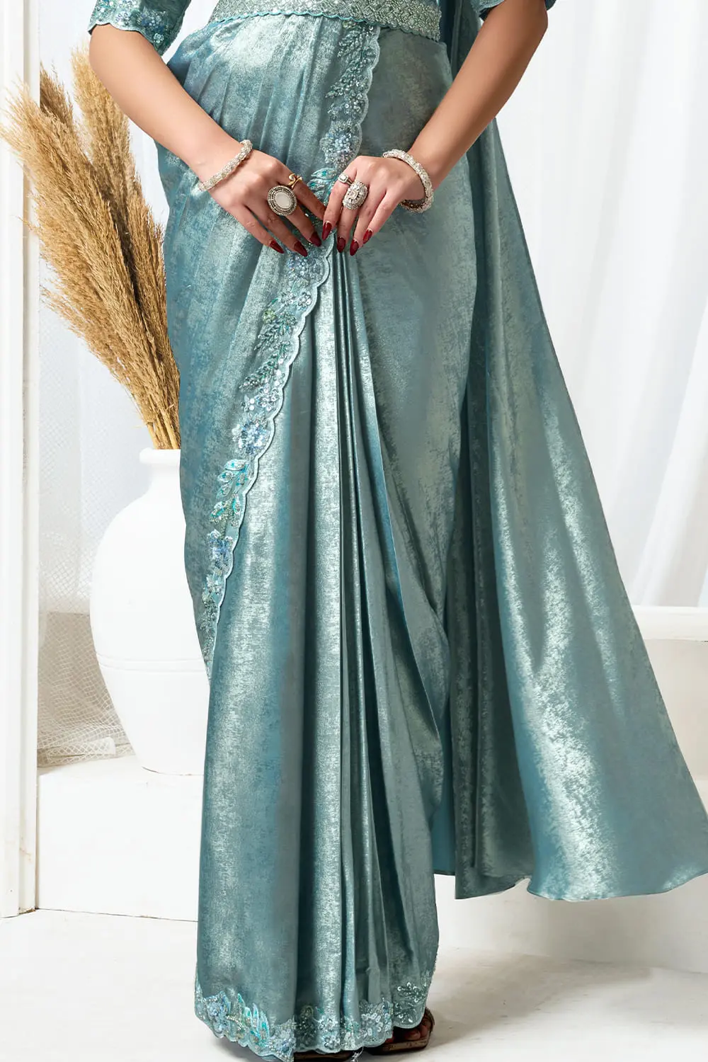 Side drape of fancy saree party wear showing cutdana and sequin details