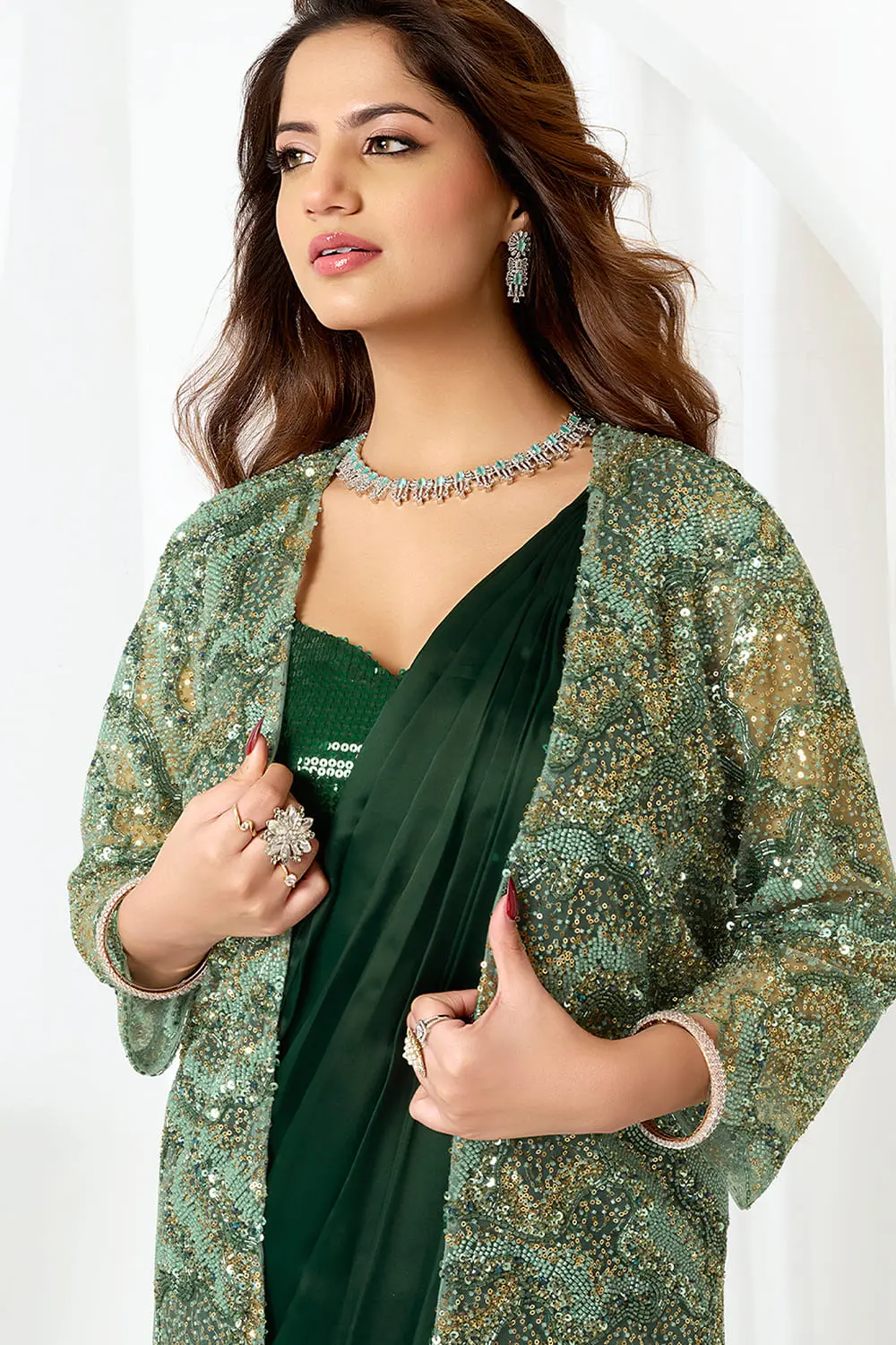 Side view of designer saree party wear showing jacket border embroidery and skirt hem