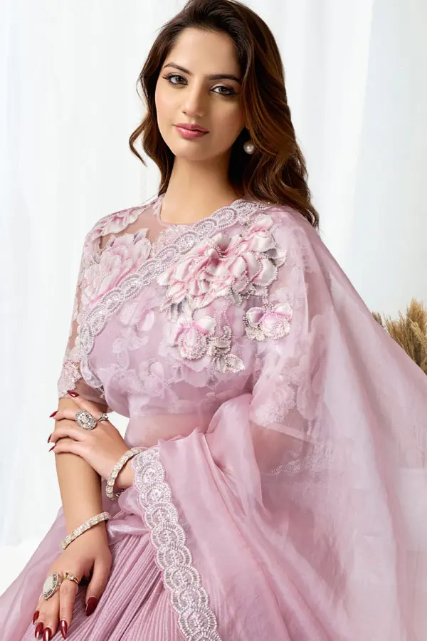Close up of cutdana and beads on pink fancy saree party wear pallu
