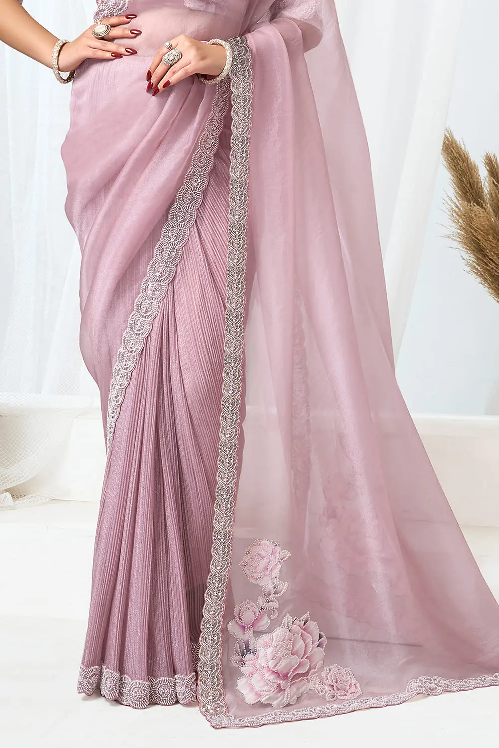 Plus size saree dress – pink saree on model with silver jewellery and clutch
