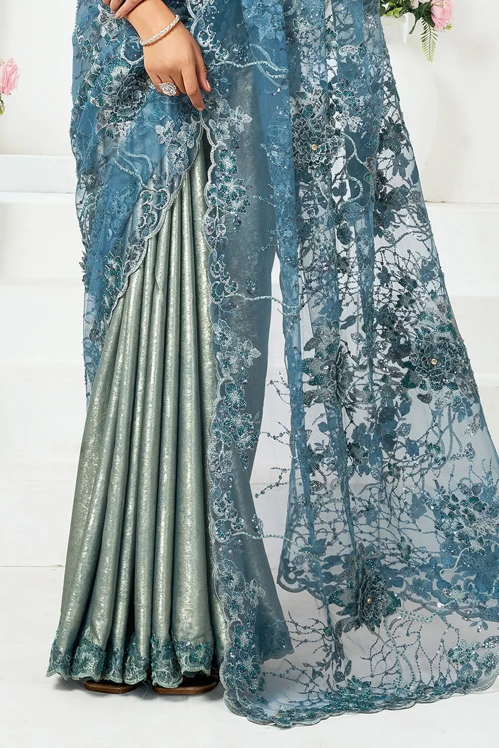Fancy saree party wear – dusty blue engagement saree on bride with silver jewellery