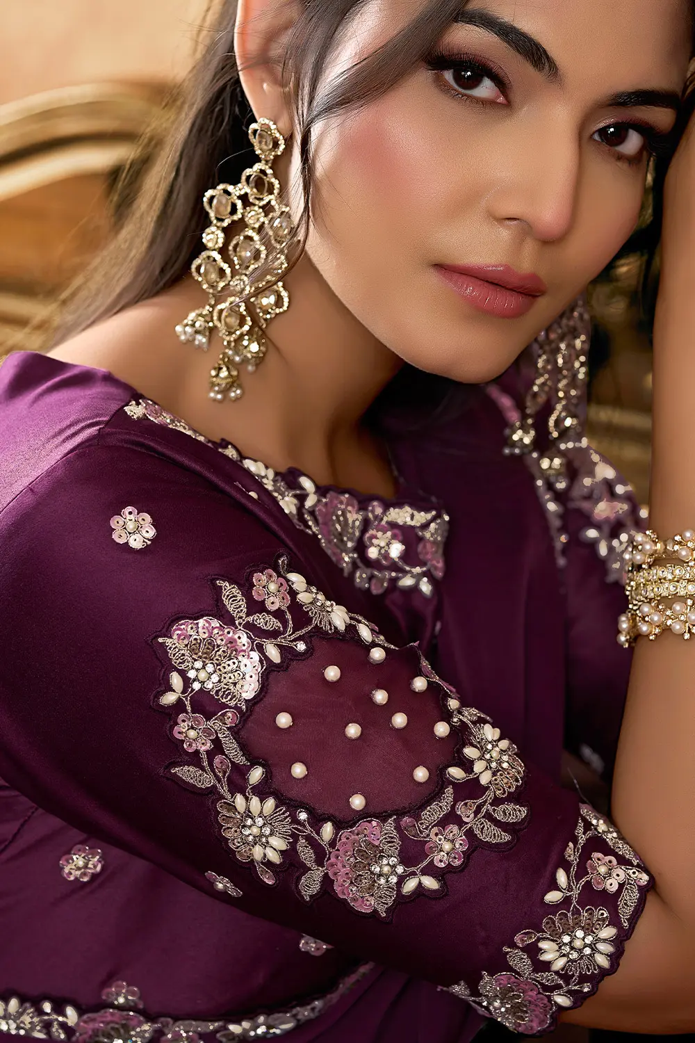 Model wearing wine party wear saree