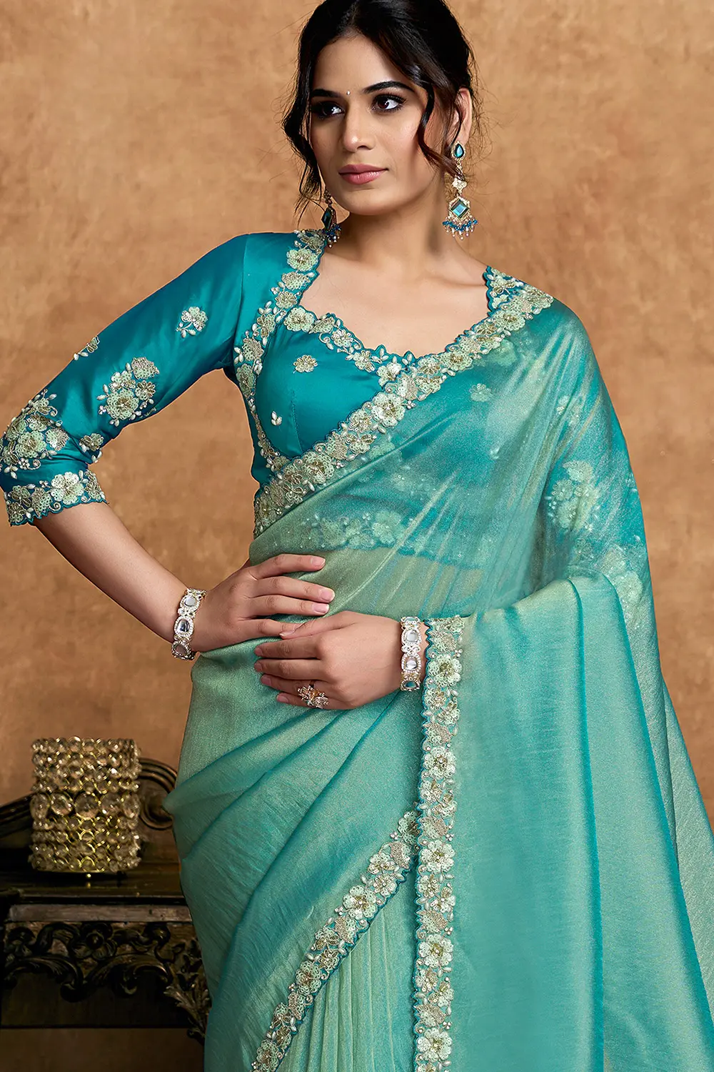 Draped organza saree showcasing shimmer texture