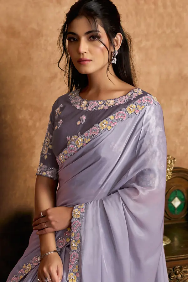 Close-up of pearl and stone detailing on lavender saree