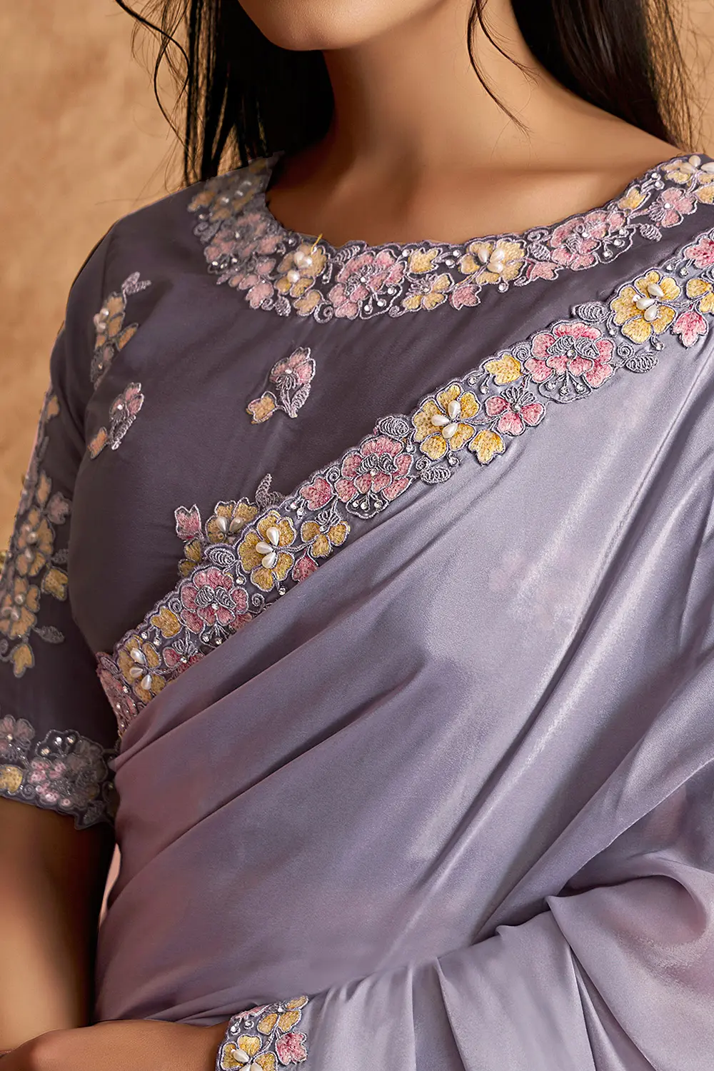 Model wearing lavender festive saree with elegant styling