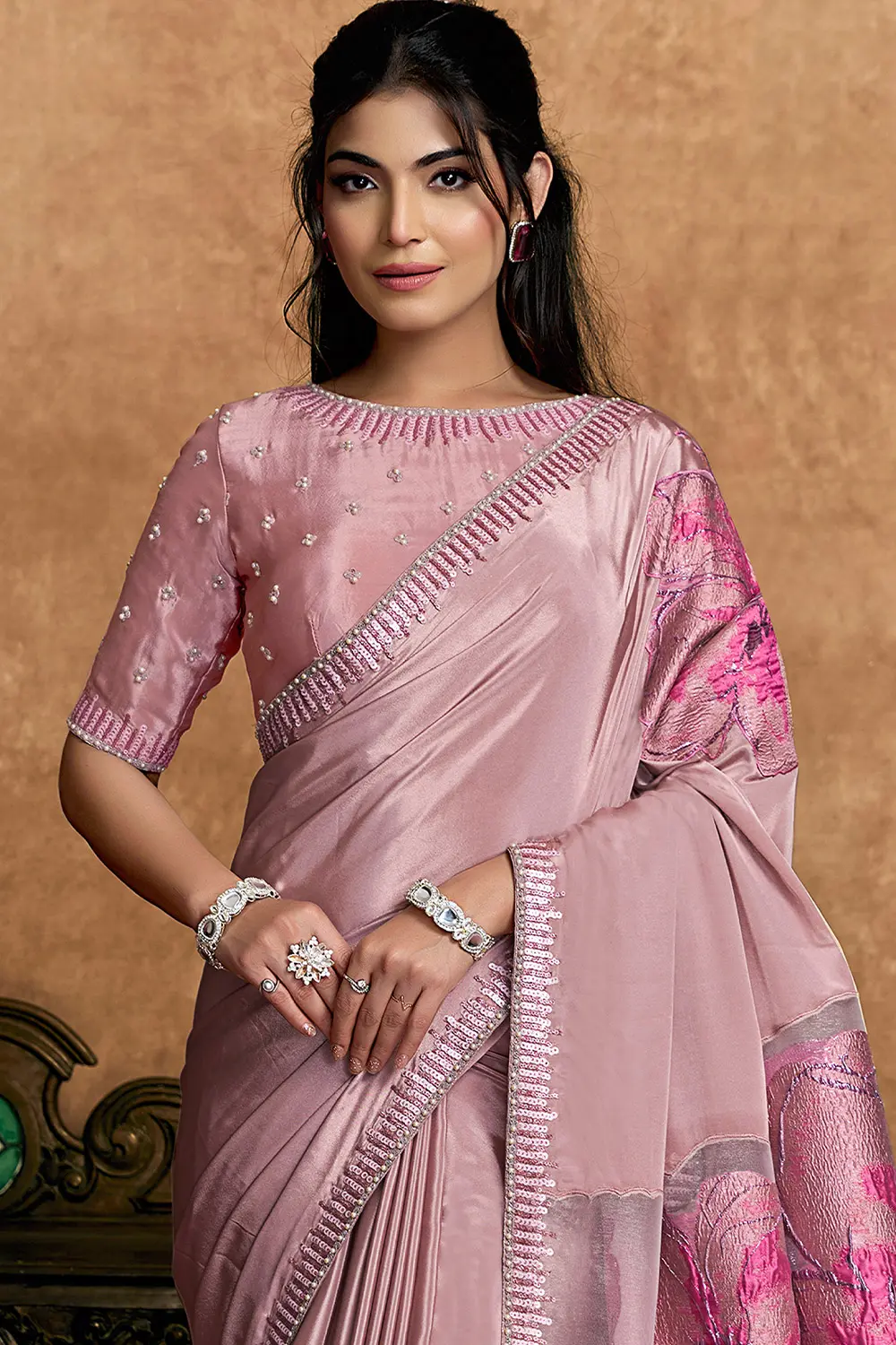 Model wearing blush pink festive saree