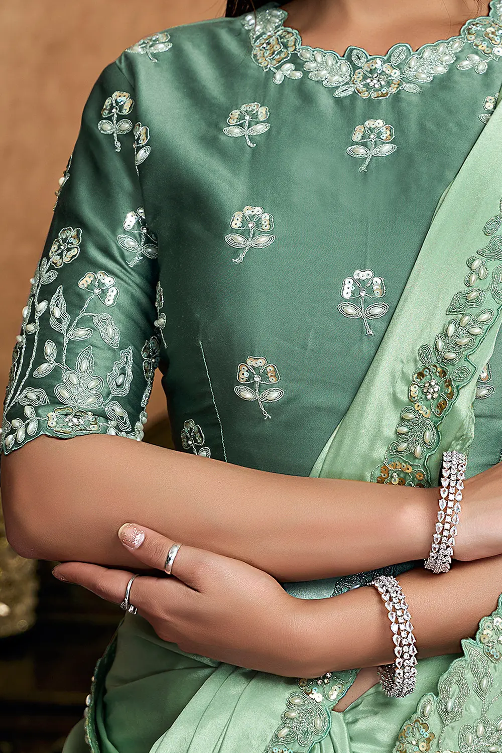 Model wearing mint green festive saree