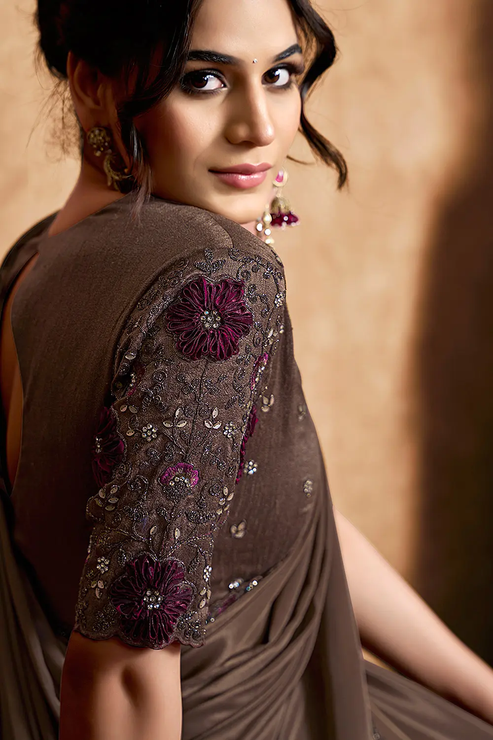 Draped satin silk saree showcasing rich texture