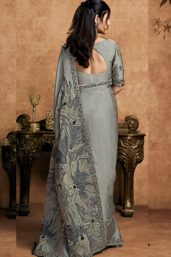 Model wearing steel grey festive saree with modern styling