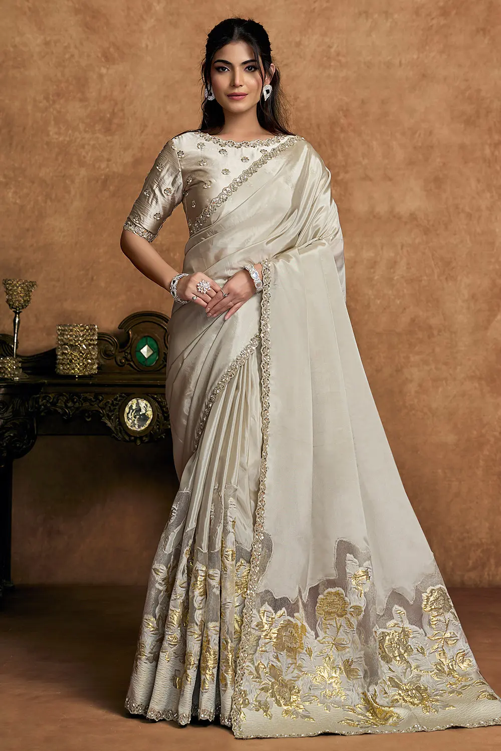Champagne Ivory Crepe Silk Saree with Sequin Embroidery & Pearl Detailing Champagne Ivory Crepe Silk Saree with Sequin Embroidery & Pearl Detailing