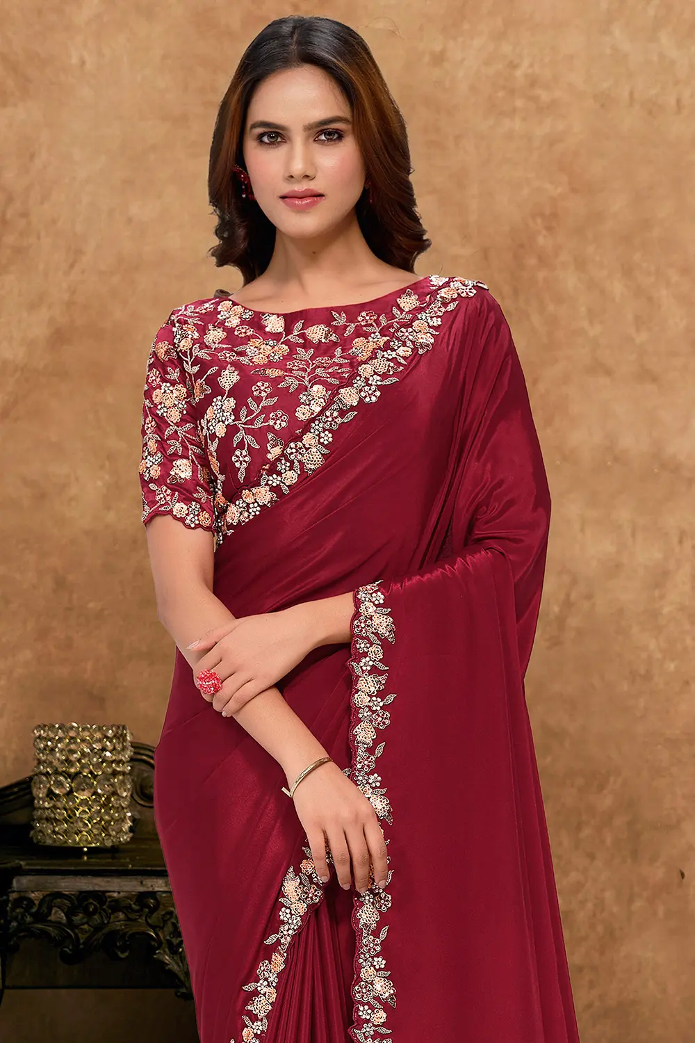 Draped satin silk saree highlighting smooth texture and shine