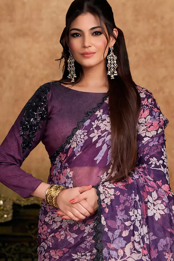 Close-up of pearl and stone work on plum saree