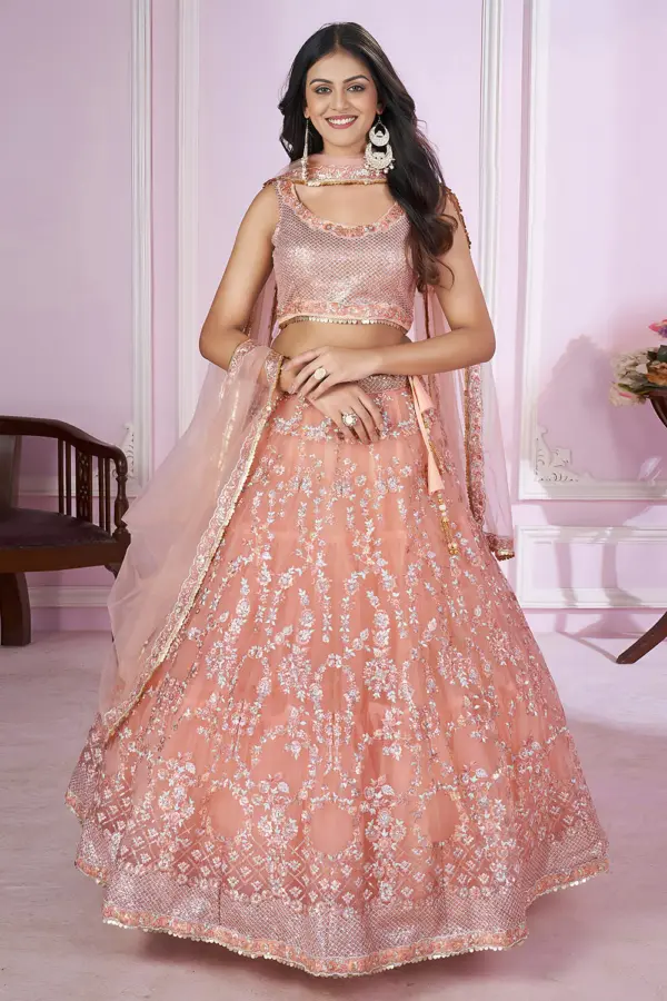 Dusty pink lehenga front view with heavy sequin and zari work on soft net fabric
