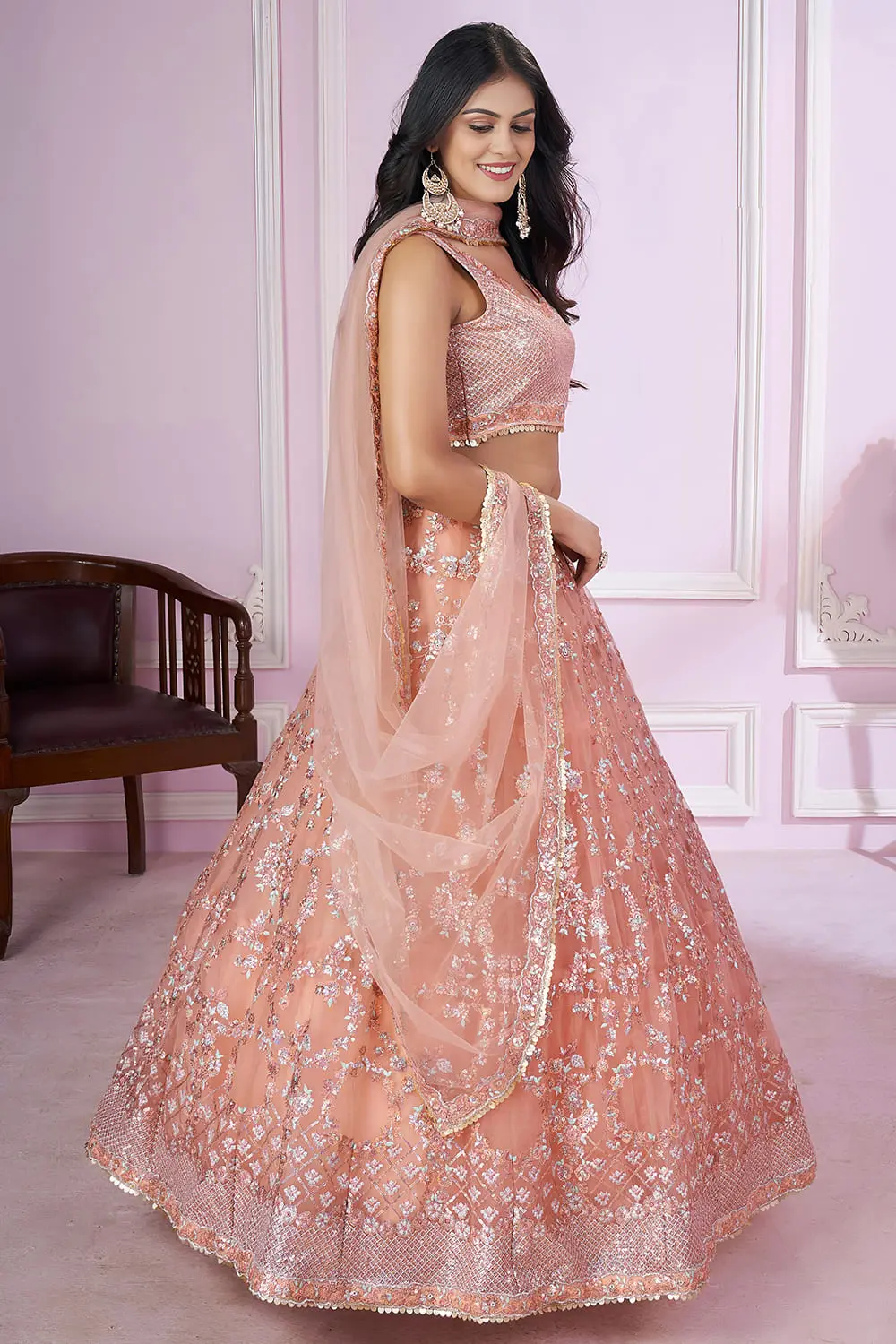 Dupatta detail with scattered sequin embroidery on dusty pink net fabric