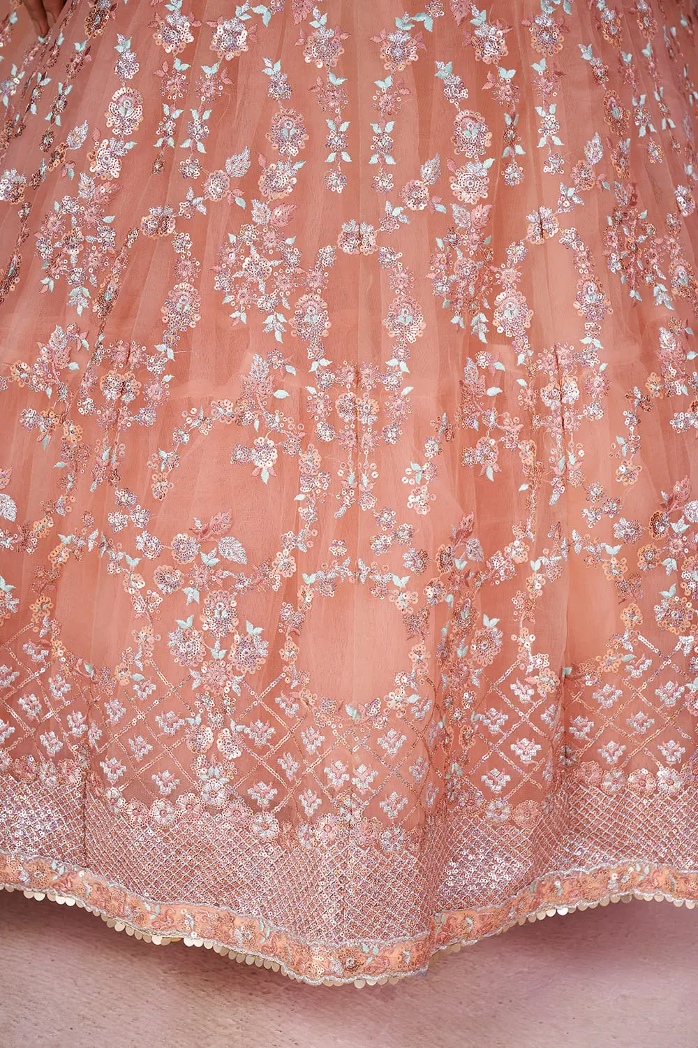 Fabric texture close up of soft net used in this dusty pink lehenga ensemble