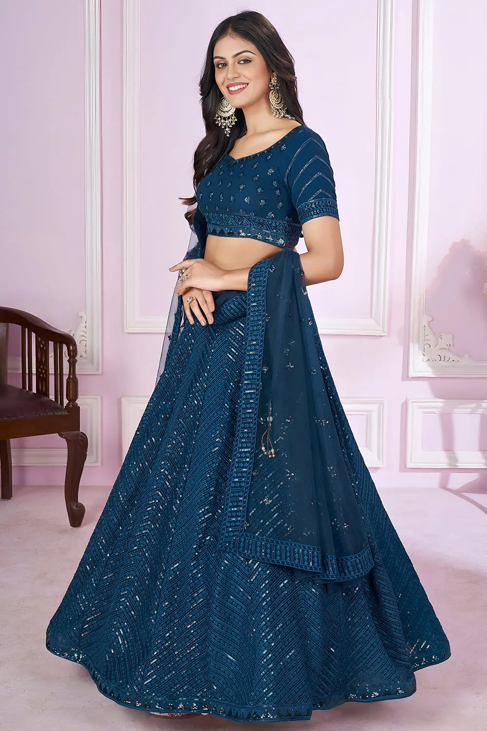 Dupatta close up featuring scattered sequins and thread work on soft net fabric