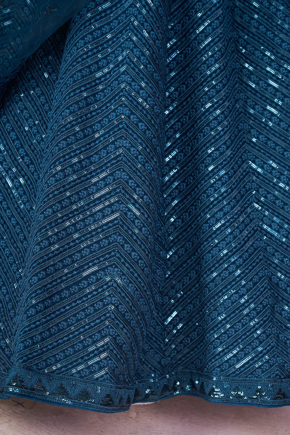 Georgette fabric texture shot of this Prussian Blue lehenga dress ensemble