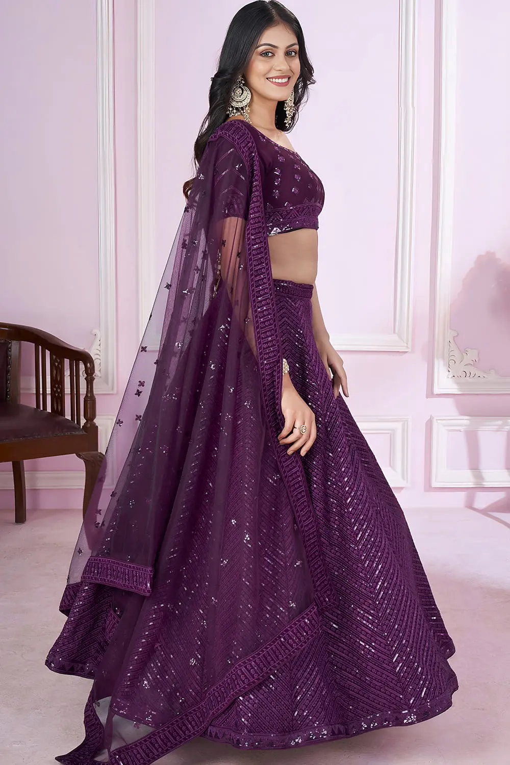 Side angle of purple georgette lehenga showing soft net dupatta drape style