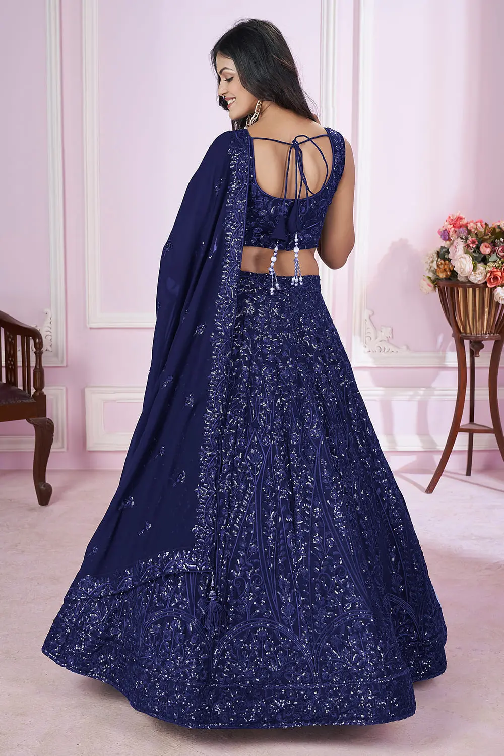 Back view of Navy Blue lehenga dress with dupatta and zari hemline details