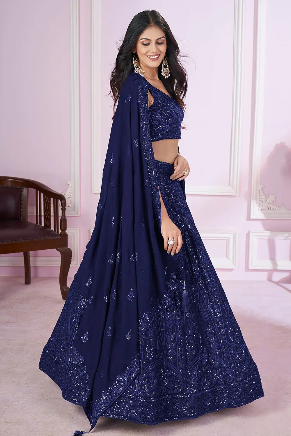 Dupatta close up featuring scattered sequins and thread work on soft net fabric