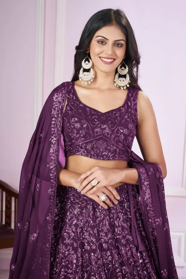 Close up of sequin and thread embroidery on purple lehenga choli blouse piece