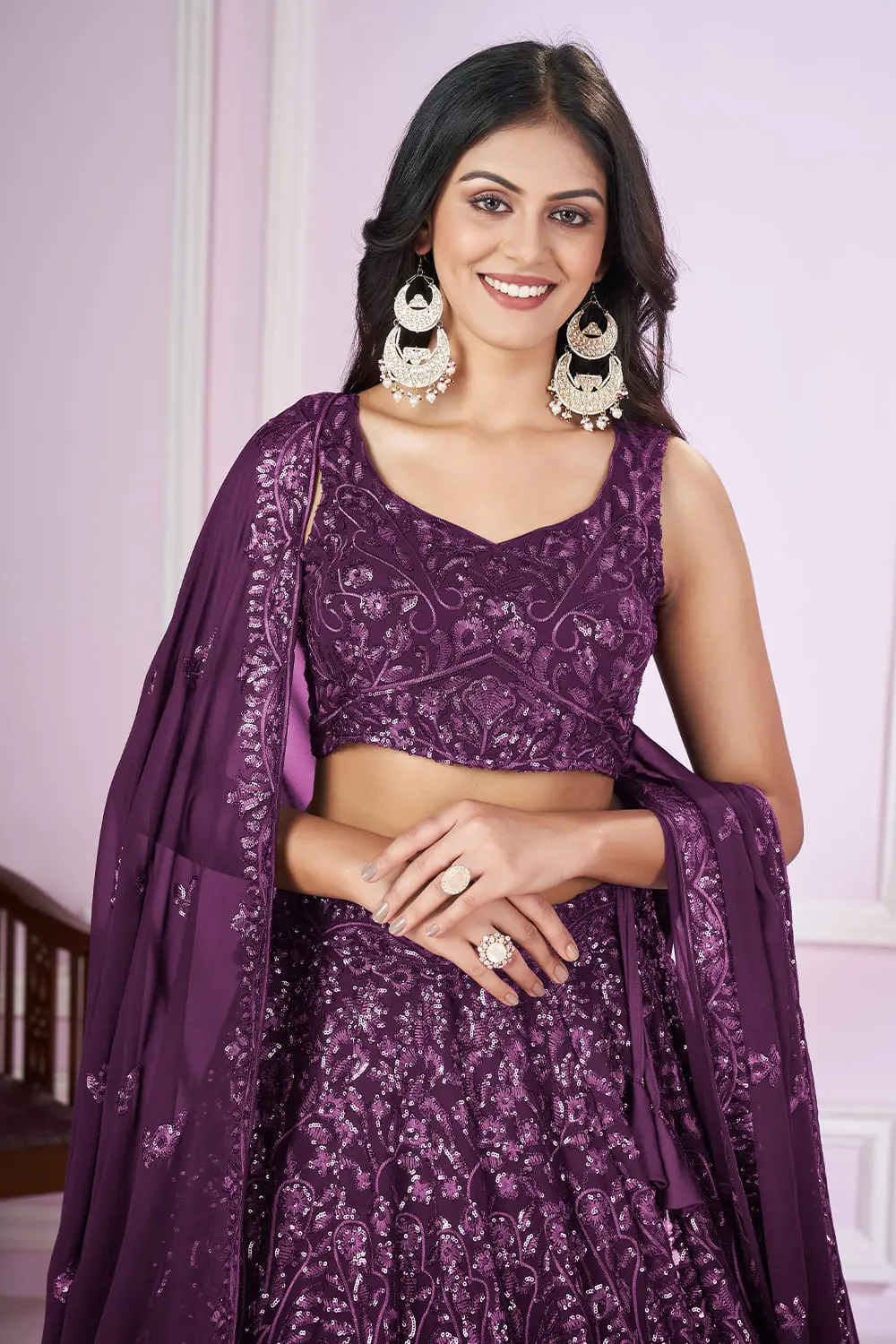 Close up of sequin and thread embroidery on purple lehenga choli blouse piece