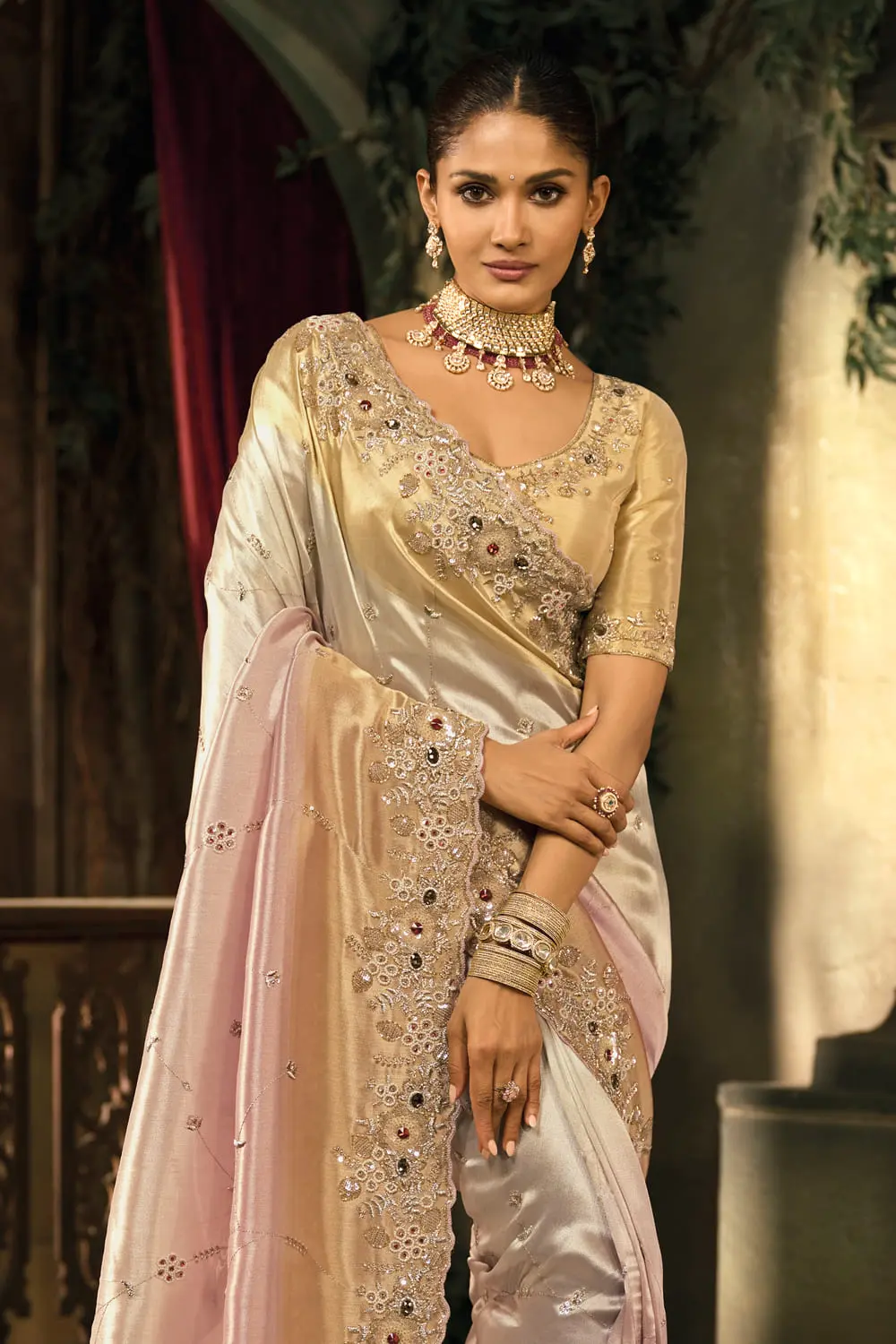 Close-up of zari and cut-dana embroidery on cream silk saree border