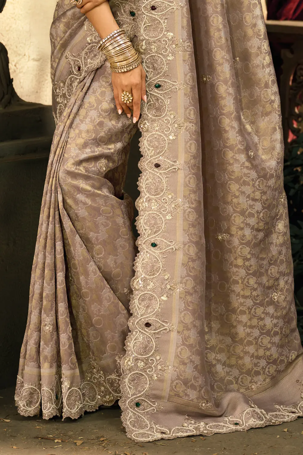 Pallu detail of pure Ziraf Chocolate Silk Saree with Moti and Emerald heavy work