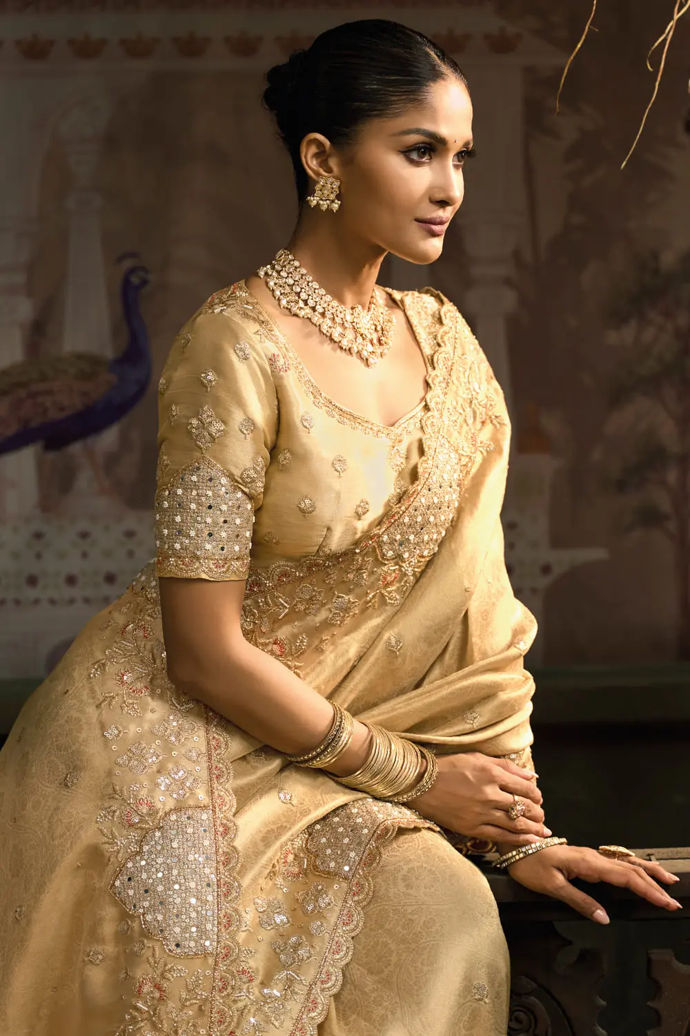 Mirror and jari detail on pallu of gold banarasi silk saree