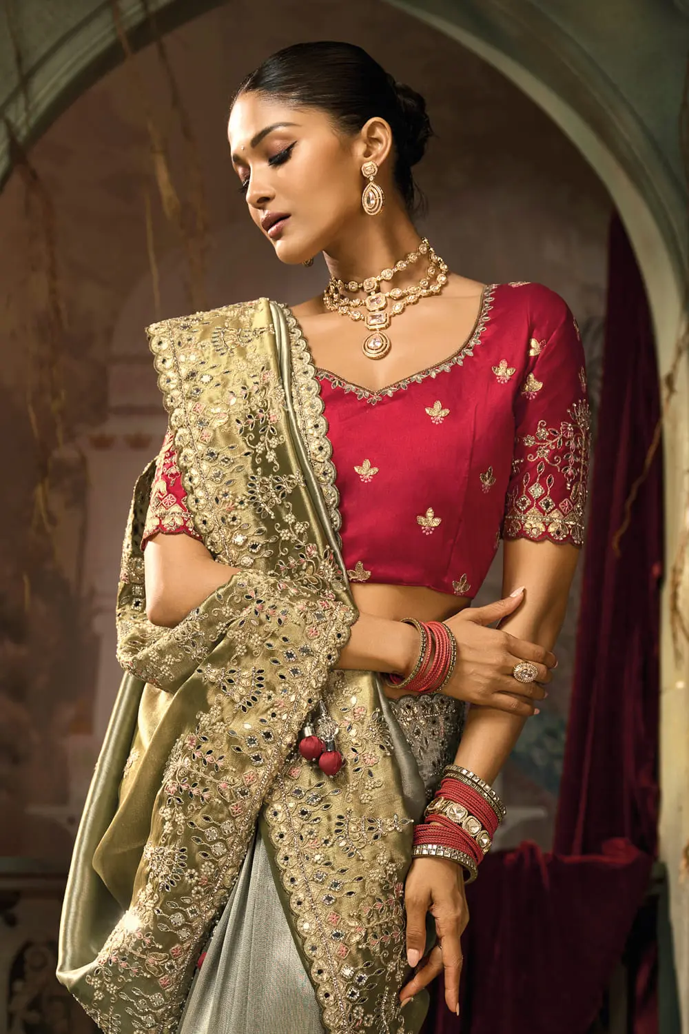 Close-up of thread embroidery and moti work on Olive Green banarasi silk saree