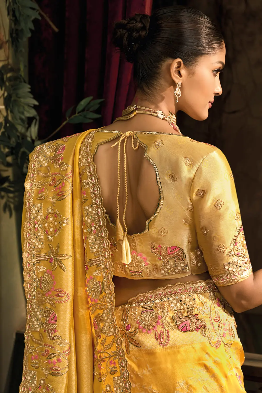 Back side view of mustard silk saree with moti work and texture